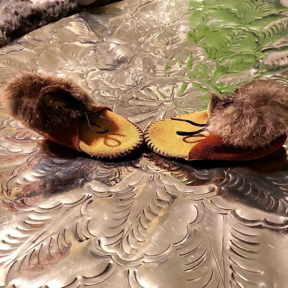 Moccasins,  real leather and real rabbit fur,  has a great insole! Size 8 child
